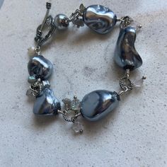 "Hand made Silver Baroque Pearls original design hand wired gray silver tone jewelry bracelet one of a kind OOAK I used the prettiest large gray baroque pearls for this bracelet. All hand made by me.   bracelet is 8\" long , adjustable   Please click on ZOOM below the photo for a huge closeup! Thanks for visiting my shop! Ask for the discounts if buying more than one lot Please check my other Etsy shop AnnaGraceDreams for vintage jewelry and one of a kind creations made by me.  https://www.etsy.com/shop/AnnaGraceDreams  Also please check my blog for updates at AnnaGraceDreams.com" Jewelry Bracelet, Baroque Pearls, Arm Band, Original Design, Original Designs, Vintage Jewelry, Silver Tone, Jewelry Bracelets, Hand Made