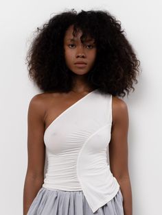 The Sakae Top features an asymmetric neckline, diagonal ruched detail, and asymmetric hem. Made from a soft, lightweight bamboo blend. White Assymetrical Top, Asymmetrical Top With Skirt, Asymmetric Tops For Women, Asymmetric Hem Top, Assymetrical Top Outfits, Asymmetrical Top Outfit, Assymetrical Top, Ocean Alley, Assignment Ideas