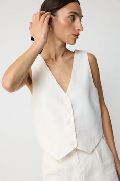 A tailored vest with a relaxed fit. A chic vest with a centre front placket, fully lined, non stretch. Pair it with the Linen Pleated Shorts for the full set. Tailored Vest, Linen Vest, Linen Tops, Contemporary Wardrobe, Pleated Shorts, Linen Top, Full Set, Diy Clothes, Lay Flat