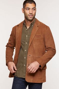 You'll be the picture of rugged sophistication in this handsome goatskin suede blazer, appropriate for midday meetings and weekends out west alike. Made of supremely smooth, untreated goatskin suede, this handsome leather mountain blazer features a classic notch collar, rear vent, and two-button closure, as well as pockets galore and buttons at the cuffs. Brown Suede Business Outerwear, Brown Suede Outerwear For Business, Brown Leather Jacket With Suede Lining For Work, Brown Leather Jacket With Suede Lining, Classic Brown Leather Jacket With Suede Lining, Classic Leather Outerwear With Suede Lining, Leather Jacket With Suede Lining For Work, Brown Suede Leather Jacket With Lapel Collar, Classic Leather Jacket With Suede Lining