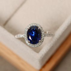 Halo engagement ring sapphire ring oval cut blue gemstone | Etsy Oval Sapphire Halo Ring For Formal Occasions, Classic Oval Sapphire Halo Ring, Oval Sapphire Halo Ring With Center Stone, Classic Oval Sapphire Ring In 14k White Gold, White Gold Oval Sapphire Ring, Classic Oval Pendant Jewelry With Center Stone, Classic Oval Sapphire Gemstone Ring, Elegant Oval Sapphire Ring In Sterling Silver, Oval Sapphire Promise Ring In 14k White Gold