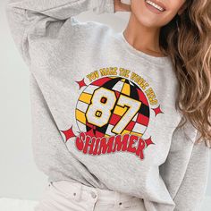 Unleash your inner Swiftie with this sweatshirt! Perfect for fans of the iconic duo, this crewneck combines comfort and style with a playful nod to the "Swift" and "Kelce" relationship. Show off your love for the game and the power couple in this quirky and fun top. Designs are printed with direct to garment, high quality inks Trendy Crew Neck Sweatshirt For Fan Merchandise, Pop Culture Letter Print Sweatshirt For Fans, Pop Culture Letter Print Sweatshirt Fan Merchandise, Pop Culture Sweatshirt With Letter Print For Fans, Retro Crew Neck Sweatshirt For Fan Merchandise, Fan Merchandise Graphic Print Crew Neck T-shirt, Fan Merchandise Crew Neck T-shirt, Hip Hop Crew Neck Sweatshirt With Slogan, Hip Hop Slogan Crew Neck Sweatshirt