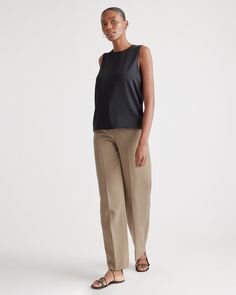 Quiet luxury meets everyday comfort in our Washable Stretch Silk Shell Tank. This whisper-light top is crafted from best-in-class mulberry silk with a hint of stretch for an ideal combination of softness and flexibility. Layered under a blazer or worn alone, its timeless design is elevated enough for special occasions yet stands up to daily wear. Best part? It's washable!  | Quince | Women's Washable Stretch Silk Shell Tank Top in Black, Size Large, Mulberry Silk Elegant Spring Tank Top With Minimal Stretch, Chic Stretch Top For Office Wear, Versatile Viscose Tops For Layering, Versatile Sleeveless Top For Business Casual, Elegant Silk Tops For Business Casual, Versatile Stretch Tops For Business Casual, Sleek Tops For Workwear, Tailored Sleek Tops For Work, Elegant Solid Tank Top For Layering