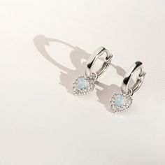 You will fall in love with the pretty details on these huggie hoop earrings for little girls. Crafted with the finest 925 sterling silver, and featuring delicate heart shaped stone at the center with clear cubic zirconia surrounding it; these earrings make for a great gift for someone special. Order this lovely pair for your little angel today and we'll include a sweet little gift box. Silver Huggie Earrings With Heart Charm, Silver Heart Charm Huggie Earrings, Silver Huggie Earrings With Heart Charm For Anniversary, Silver Huggie Earrings With Heart Charm For Gift, Silver Sterling Huggie Earrings With Heart Charm, Silver Sterling Heart Charm Huggie Earrings, Silver Huggie Heart Charm Earrings, Silver Huggie Jewelry With Heart Charm, Silver Small Hoop Earrings With Heart Charm