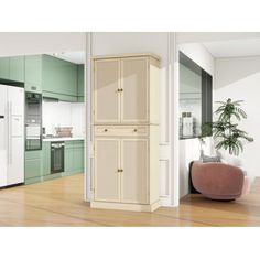 a white refrigerator freezer sitting inside of a kitchen next to a potted plant