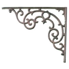 an ornate iron shelf bracket on a white background