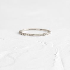 Eleven round diamonds (1mm, SI clarity, G+ color) Total carat weight: .06ct. Solid 14k gold setting with a delicate 1.2mm round band (available in yellow, white, or rose gold or platinum) We handcraft each piece with responsibly sourced 14k gold and ethically sourced stones. Dainty Gold Band, Handcrafted Engagement Ring, Melanie Casey, Morse Code, Rose Gold Band, Oval Cut Diamond, 14k Gold Ring, Gold Set, Jewelry Rings Engagement