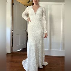 I Loved This Dress! It’s Unworn Other Than To Take Pictures, Used As A Backup Dress For My Other Wedding Dress. It’s A Heavier Material And Would Probably Work Best For A Fall/Winter Wedding. Form Fitting With A Little Train! I’m 5’8” And The Length Was Good (Without Heels). Would Fit A 6-8. Material Has Stretch, Just Not In The Arms. V-neck Wedding Gown With Sweep Train, Long Sleeve Lace Dress With Fitted Bodice For Wedding, V-neck Wedding Dress With Sweep Train, Fitted Bridesmaid Gown With Lace Sleeves, Fitted V-neck Mother Of The Bride Dress For Wedding, Long Sleeve Scalloped Lace Wedding Dress, Elegant Fitted Gown For Bridal Shower, V-neck Scalloped Lace Dress For Wedding Night, Fitted V-neck Wedding Gown