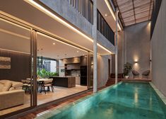 an indoor swimming pool in the middle of a house