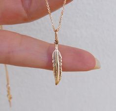 "Dainty 18k solid gold feather pendant charm beautifully detailed Perfect gift for the love of self, the one you Love! Made with love at our Temple jewels studio. Custom orders welcomed! Can be ordered as a Pendant only or with a chain 16\" or 18\" chain. See more: To my shop: https://www.etsy.com/shop/templejewelsibiza" Elegant Feather Jewelry As Gift, Elegant Feather Jewelry Gift, Elegant Feather Jewelry For Gift, Feather Pendant Jewelry As Gift, Feather Necklace Gift, Feather Pendant Jewelry For Gifts, Gold Feather Necklace Perfect For Gifting, Gold Necklace With Feathers As A Gift, Gold Feather Necklace For Gift