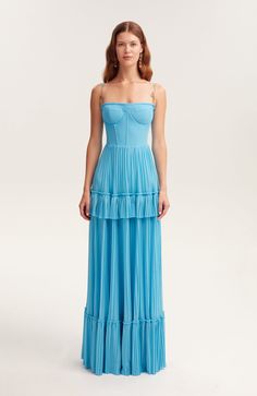 Elevate your presence in a sky-blue pleated maxi mesh dress with a structured bustier bodice and delicate spaghetti straps. The A-line skirt adds elegance, perfect for any special occasion. Material: Combined fabric Fabric composition: 100% Polyester Neckline: Straight Back: Zipper Lining: Sky-blue full-length skirt Skirt length from waist: 45.2 inches Dress weight: 2.24 lbs Model is: 5'11" / 33-24-37, wearing size S Machine wash up to 86ºF gentle cycle Do not bleach Use steamer for ironing up t Dress Garden, Dress Weights, Full Skirt Dress, Prom Dress Inspiration, Pleated Maxi Skirt, Garden Of Eden, Bustier Dress, Dress Crafts, Pleated Maxi Dress