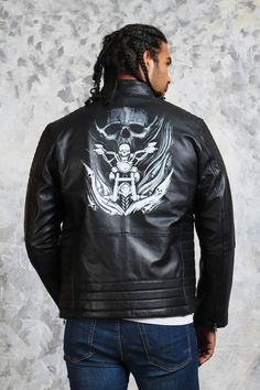 Skull Leather Jacket - Men's Biker Black Leather Jacket This Biker leather jacket is one of the finest designs our experienced craftsmen have designed this season. It features front-zipped closure, 4 spacious zipper pockets on its front with quilted padded sleeves and shoulders. Skull leather jacket emphasizes primarily on an eye-catching image of “biker skull” art printed on its back with super edgy details. Finally completed with a snap button collar and adjustable zipper sleeves this men’s bl Black Edgy Outerwear With Skull Print, Biker Outerwear With Skull Print For Fall, Biker Style Skull Print Outerwear For Fall, Biker Style Leather Jacket With Long Sleeves, Biker Style Leather Jacket For Biker Events, Cafe Racer Biker Jacket For Streetwear, Black Cafe Racer Leather Jacket For Biker Events, Black Biker Leather Jacket For Streetwear, Biker Style Leather Jacket For Streetwear