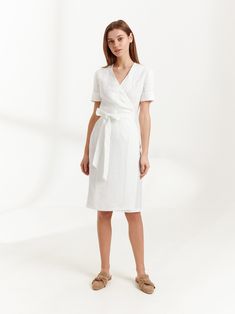 "BRIGITTE is a short sleeve linen wrap dress. DETAILS - True wrap closure - A-line style skirt - Above elbow sleeves - Knee length - 100% lightweight European linen fabric - Cut and sewn to order just for you in our studio COLOR - White, you can also choose other colors above - Fabric samples are available here https://www.etsy.com/listing/586569696/linen-fabric-samples SIZING & FIT - Fits true to size - Bust is approximately 35 inches / 88 cm - Length is approximately 42 inches / 106.5 cm - Summer A-line Belted Wrap Dress, Fitted Belted Linen Dress, Elegant Short-sleeved Wrap Dress With Tie Waist, Elegant Short Sleeve Linen Dress For Work, Elegant Fitted Belted Linen Dress, Elegant Short Sleeve Wrap Dress For Daywear, Summer Belted A-line Wrap Dress, Fitted Belted Short Sleeve Wrap Dress, Fitted Belted Wrap Dress With Short Sleeves