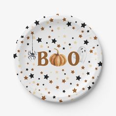 a paper plate with the word boo written on it and stars around it, as well as a spider