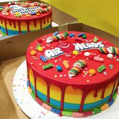 two birthday cakes decorated with candy and candies