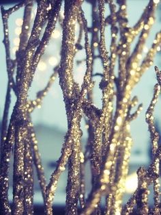 the branches are covered in gold glitter