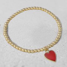 "* 3 mm Gold Filled (14/20) Beads * Heart Charm (Sterling Silver) with Enamel Finish * Available in Red, Black, and Turquoise Enamel Available in Various Sizes. Please choose from drop down list. I make 6.5\" for most wrist size To determine your bracelet size: Measure with a tape around your wrist (where you would like the bracelet to sit). If you don't have access to a measuring tape, wrap a string around your wrist and measure the length with a ruler. This is your wrist size. To determine you Beaded Heart, Bracelet Heart, Enamel Bracelet, Stackable Bracelets, Layered Bracelets, Evil Eye Bracelet, Beaded Stretch Bracelet, Photo Bracelet, Heart Bracelet