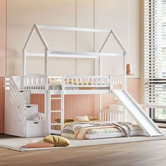 a white bunk bed with a slide in the middle