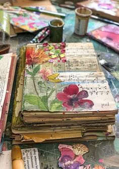 an altered book with flowers and music notes