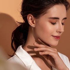 Elevate your style with these stunning asymmetric flower branch stud earrings and ear cuff. One earring boasts a long, elegant floral branch with a delicate tear drop dangle, while the other is a simple stud earring. Crafted from solid 925 sterling silver with platinum plating and adorned with sparkling cubic zirconia stones, these earrings exude both luxury and sophistication. Don't miss out on adding this unique pair to your collection! Materials: 925 sterling silver, cubic zirconiaFinish: pla Dainty Wrap Earrings, Elegant Rose Gold Ear Cuff, Elegant Rose Gold Wrap Earrings, Elegant Matching Cartilage Earrings For Gift, Elegant Cartilage Drop Earrings, White Ear Climbers For Formal Occasion, Elegant Formal Cartilage Earrings, Wedding Wrap Earrings, Elegant Rose Gold Ear Cuff For Wedding