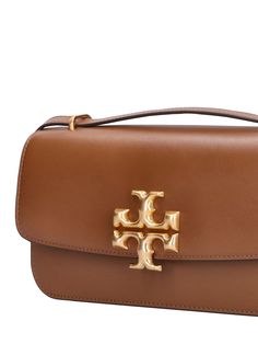 Height: 12.5cm Width: 23.5cm Depth: 6.2cm. Leather strap. Front flap with magnetic closure. Front metal logo detail. One internal zip pocket Ski Accessories, Tory Burch Bags, Tory Burch Bag, Metal Logo, Swim Accessories, Heeled Loafers, Metallic Logo, Women's Bags, Magnetic Closure