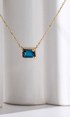 Description - 14k gold - Center stone: Baguette Cut 6 x 4 mm Blue Topaz (London) - 18" to 17" Adjustable Please note: If you require a different length chain email us to inquire. Thank you! * Ready to Ship in 14 Business Days This jewelry is: ✪ Anti-Fading ✪ Nickel Free ✪ Non-Irritating metal ✪ Metal Allergy Free / Hypoallergenic ✪ Tarnish Resistant ✪ One Year Warranty ✪ 7 days return policy How we wrap your jewelry We wrap your jewelry in a cute and secure Ke Bella Jewelry branded Gift Box. Thi Blue Emerald Cut Gemstone Necklace, Blue Emerald Cut Necklace Fine Jewelry, Blue Emerald Cut Fine Jewelry Necklace, Emerald Cut Blue Necklace As A Gift, Emerald Cut Blue Necklace For Gift, Blue Emerald Cut Necklace For Gift, Sapphire Necklace With Baguette Cut For Gifts, Sapphire Necklace Baguette Cut For Gift, Sapphire Baguette Cut Necklace For Gift