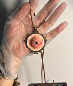 💚Get ready for Halloween with this extraordinary handmade clay eye pendant necklace! This unique piece is a must-have for anyone who loves gothic and unconventional jewelry, especially during the spookiest time of the year. The pendant features a realistic, intricately detailed eye set in a vintage-inspired brass frame, suspended on an adjustable suede cord. It's the perfect accessory to add a creepy yet stylish touch to your Halloween costume or everyday gothic attire.💚 📣Features📣    Materi Creepy Eye Necklace, Heart Eye Necklace Clay, Unconventional Jewelry, Gothic Attire, Creepy Jewelry, Clay Eye, Creepy Gift, Necklace Clay, Eye Pendant Necklace