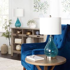 a living room filled with furniture and a blue chair