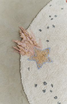 a white rug with a star design on it