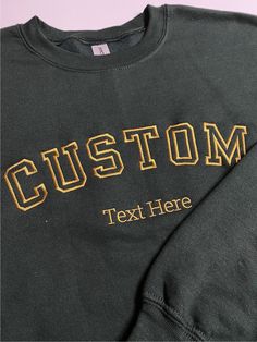 * Your custom text embroidered on super soft and comfortable 50/50 cotton/poly sweatshirt. * Sizes are in Unisex/Men's sizing and runs normal. * Size charts shows the sweatshirt measurement when it is laid flat. Embroidered Logo Sweatshirt For College In Winter, Winter Crew Sweats With Embroidered Logo, Sporty Embroidered Crew Sweatshirt, Sporty Crew Neck Hoodie With Custom Embroidery, Black Crew Sweatshirt With Embroidered Graphics, Sporty Cotton Sweatshirt With Custom Embroidery, Black Sweater With Letter Embroidery For Winter, Sporty Black Embroidered Sweatshirt, College Crew Sweatshirt With Embroidered Logo