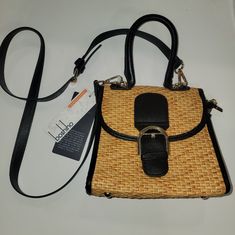 This Charming Crossbody Bag By Boshiho Features A Retro Straw Woven Design That's Perfect For Any Casual Or Formal Occasion. With A Small And Compact Size Of 4.3'' In Width, 7.9'' In Height And 9.4'' In Depth, It's Perfect For Carrying Your Essentials Without Weighing You Down. The Bag Comes With A Top Handle And An Adjustable Cross-Body Strap For Added Convenience.The Bag Is Made With A Combination Of Faux Leather, Pu Leather, And Straw, With Gold-Plated Hardware Accents. It Features A Variety Black Straw Bag With Adjustable Strap For Everyday Use, Black Straw Tote Bag With Detachable Strap, Black Leather Straw Bag With Adjustable Strap, Black Leather Shoulder Bag For Vacation, Adjustable Brown Rectangular Bag, Brown Adjustable Rectangular Bag, Casual Black Leather Straw Bag, Black Straw Crossbody Bag With Detachable Strap, Black Straw Bag With Detachable Strap For Vacation