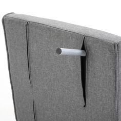 the back end of a gray couch with metal handles