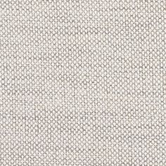 an upholstered white and grey fabric textured with small circles on the surface