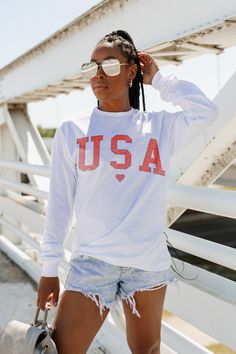 This classic long sleeve tee is perfect for any occasion. It features a bold graphic on the front. The comfortable fit and classic style make it a great choice for everyday wear. It's perfect for showing off your American pride and looks great with jeans or shorts. Get ready to show off your patriotism in this stylish and comfortable tee. PRODUCT DETAILS: 60% cotton 40% polyester True To Size Colors May Vary Patterns May Vary Born In The Usa, American Pride, Casual T Shirts, Long Sleeve Tee, Looks Great, Classic Style, Everyday Wear, Long Sleeve Tees, Comfort Fit