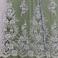 Let the beauty of our Beaded & Corded lace fabric lift the elegance of any special occasion. Made from 100% Polyester Net Mesh, this beautiful fabric is lovingly embroidered with pearls and sequins. It is the perfect choice for wedding dresses, evening gowns, quinceanera dresses, dance costumes, and more. Our collection of Beaded and Corded couture lace and bridal lace, has something for every woman who wants to look her best. Whether it's for a special occasion or for a momentous evening, our f Quinceanera Crown, Dresses Dance, Corded Lace Fabric, For Wedding Dresses, Bridal Lace Fabric, Holiday Hours, Corded Lace, Lace Evening Dresses, Bridal Tiara