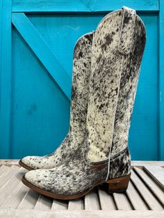 Introducing Plain Jane Cowhide Hair-On Tall Cowgirl Boots - a timeless and refined addition to your equestrian-inspired wardrobe. Exuding effortless elegance, this iconic design is a must-have for any fashion-forward woman. Each pair of boots is individual in genuine cowhide hair-on pattern. Please see pictures for exact pattern on each size. The picture shown with each size is the exact picture of the boot you would receive. If you have any questions regarding this boot, please contact us at or Cowhide Boots Women, Hair On Hide Boots, Elegant Fitted Boots For Ranch, Elegant Wide Calf Riding Boots, Chic Calf Hair Boots With Round Toe, Luxury Snip Toe Boots For Galas, Calf Hair Boots With Leather Sole And Round Toe, Classic Boots For Ranch And Winter Season, Classic Boots For Ranch And Winter