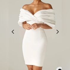 Made From A Luxurious Soft Heavyweight Crepe That Really Sculpts And Shapes Your Figure To Cinch Your Waist And Create The Perfect Figure Hugging Silhouette. The Oversized Satin Ruffles To The Shoulders Add Drama Yet It Sits Perfectly In An Off Shoulder Cut. The Boning Detailing Extends Down To The Waist In A Pretty Shape And Through The Back And Sides To Really Exaggerate The Curves And Underwired Cups Design Means You Don't Need A Bra. - Lining: Fully Lined - Made From: Crepe And Satin Fabrics - Stretch Factor: 1/3 - Dress Length: Approx. 36" In - Material: Crepe (95% Polyester, 5% Elastane), Satin (97% Polyester, 3% Elastane) - Care: Gentle Dry Clean Only Ruffle Shoulder Dress, Satin Fabrics, Hugging Silhouette, Perfect Figure, Shoulder Cut, Cup Design, Dress Short, Dress White, Satin Fabric