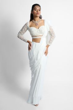 Ivory pre-draped ruffle saree. Paired with floral embroidered padded blouse and belt. - Aza Fashions Elegant Fitted Pre-draped Saree For Wedding, Elegant White Pre-draped Saree For Wedding, Festive White Pre-draped Saree With Ruffles, Elegant White Georgette Pre-draped Saree, White Pre-draped Saree With Ruffles, Elegant Fitted Pre-draped Saree With Ruffles, Elegant Off White Traditional Drape Dress, White Pre-draped Gown For Party, Elegant Off-white Traditional Drape Dress