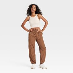 Level up your athleisure wardrobe with these Mid-Rise Woven Cinched Pants from JoyLab™. Made of nylon with added spandex, these mid-rise pants feature front elastic for easy movement. Tailored in athletic fit, these pull-on pants are easy to wear and pair well with crop tops, tees and sweatshirts. JoyLab™: A movement that’s always in motion. Stretch Nylon Cargo Pants With Moisture-wicking, Sporty Nylon Yoga Pants With Elastic Waistband, Stretch Nylon Cargo Pants For Sports, Sports Stretch Nylon Cargo Pants, High Waist Nylon Sports Pants, Casual High Waist Nylon Yoga Pants, Sporty Stretch Cargo Pants With Moisture-wicking, Fitted Mid-rise Sporty Cargo Pants, Casual High Stretch Sweatpants With Elastic Waistband