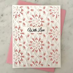 a pink and white greeting card with the words, with love written on it's side