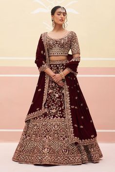 Buy Maroon Velvet Embroidered Zardozi Leaf Floral Bridal Lehenga Set For Women by Angad Singh Online at Aza Fashions. Festive Bollywood Heavy Lehenga, Velvet Choli With Dupatta For Diwali, Reception Velvet Lehenga, Heavy Lehenga For Diwali, Heavy Lehenga For Diwali Festivities, Bollywood Heavy Designer Wear Sets, Bollywood Designer Heavy Sets, Festive Heavy Lehenga For Reception, Velvet Lehenga With Traditional Drape For Eid