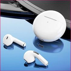 an apple airpods sitting on top of a table next to another device with ear buds