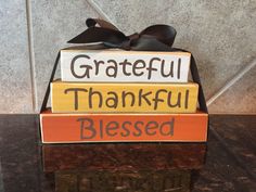 a wooden block with the words grateful, thankful, and blessing written on it