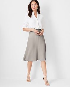 Elevate your wardrobe with the Ann Taylor Flare Skirt in Fluid Crepe, a piece that perfectly marries sophistication with a playful twist. This skirt, in an elegant Ivory Whisper shade, is a must-have for any fashion-forward woman.

- Size: Regular - 4
- Color: Ivory Whisper
- Material: 95% Polyester, 5% Spandex
- Length: 27 inches long, hits at knee
- Fit: Tailored fit
- Closure: Hidden back zipper with hook-and-eye
- Care: Machine washable
- Gender: Female
- Age Group: Adult

Designed for a sea Ivory Skirt, The Flare, Knitted Suit, Crepe Fabric, Business Casual Outfits, Eye Care, Office Wear, Size 00, Flare Skirt