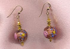 "Vintage Italian Wedding Cake Beads, Crystal Clear Fiorato, Murano Glass Earrings, handmade with 14mm Round, Venetian Beads. These detailed Italian, lamp worked beads are made with crystal clear colored Murano glass, Aventurina (copper), pink \"roses\", and blue and yellow \"forget-me-knots\". Some people refer to these beads as \"wedding cake\" beads; but the Italians call these beads \"Fiorato\" (flowered). I refer to them as Antique Fiorato. The crystal clear dangle earrings are shown in the Gold Elegant Beaded Earrings With Large Beads, Elegant Gold Beaded Earrings With Large Beads, Czech Glass Round Jewelry For Wedding, Pink Round Jewelry With Bead Caps, Elegant Round Earrings With Large Beads, Elegant Gold Earrings With Large Beads, Gold Round Beads Earrings For Wedding, Gold Earrings With Round Beads For Wedding, Czech Glass Jewelry With Round Beads For Celebrations