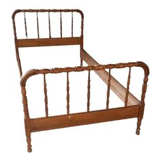 an old wooden bed frame with wood slats