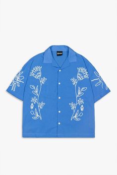 "Limited Edition Men's Floral Embroidery Oversize Short Sleeve Linen Blue Shirt - Casual Fashion, Trendy Menswear, "Oversized Fit for Comfortable and Relaxed Style, Street Style, Summer Shirt New season, short-sleeved men's shirt. PRODUCT FEATURES -Embroidered print -Linen fabric -Button closure -Short sleeves -Oversize fit ABOUT US As Rexec Vision, we offer you street style online with our many years of industry experience. Why? Because, we wanted to make something bigger, unique, innovative, c Trendy Shirts Men, Mens Fashion Copenhagen, Embroidered Oversized Summer Shirt, Oversized Embroidered Shirt For Summer, Summer Oversized Embroidered Shirt, Embroidered Camp Shirt With Relaxed Fit, Casual Embroidered Top With Camp Collar, Summer Floral Embroidery Relaxed Fit Shirt, Summer Floral Embroidered Relaxed Fit Shirt