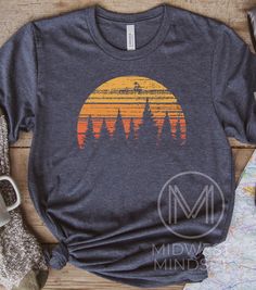 This shirt makes the perfect gift for someone who loves forests, hiking, and camping. Forest Sunset Shirt Tree Nature Shirt Retro Sunset Graphic Summer Vacation Up North Tee Wisconsin Hiking Shirt Camping Sweatshirt Bellas Canvas 3001T:  T-Shirt Sizing Please reference the size chart before selecting shirt size.  Use one of your own t-shirts to measure the size and fit.  Then compare with the size chart provided to ensure an accurate fit. T-Shirt Materials 100% combed and ring-spun cotton. Heath Short Sleeve Shirt For Outdoor Fall Activities, Short Sleeve Shirt For Fall Outdoor, Outdoor Short Sleeve Tops For Fall, Outdoor Fall Short Sleeve Tops, Short Sleeve Tops For Outdoor Fall Events, Short Sleeve Tops For Fall Outdoor, Short Sleeve Tops For Fall Outdoor Events, Fall Hiking T-shirt With Graphic Print, Casual Graphic Print Camp Shirt For Hiking