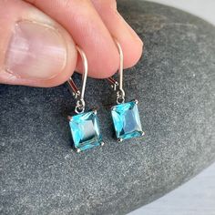 Aquamarine Earrings March Birthstone Aqua Blue Emerald Cut - Etsy Sterling Silver Rectangular Gemstone Earrings, Rectangular Blue Topaz Jewelry Gift, Rectangular Blue Topaz Jewelry, Gift Blue Topaz Rectangular Jewelry, Rectangular Blue Birthstone Jewelry, Blue Rectangular Birthstone Jewelry, Oblong Jewelry With Matching Earrings For Gifts, Oblong Jewelry Set With Matching Earrings As Gift, Jewelry Set With Matching Earrings As A Gift