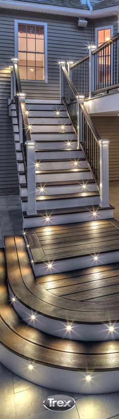 some steps lit up with lights in front of a house